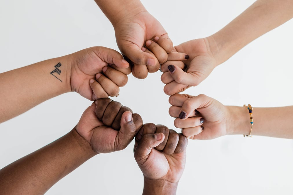 Diverse Hands Forming a Circle on White Background